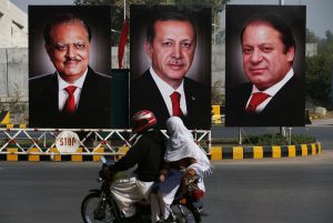 ISLAMABAD, PAKISTAN - NOVEMBER 16: Posters illustrating the images of Turkish President Recep Tayyip Erdogan (C) ,Pakistani President Mamnoon Hussain (L) and Prime Minister Nawaz Sharif (R) are seen on the poles on the main highway prior to the arrival of the Turkish President Recep Tayyip Erdogan in Islamabad, Pakistan, on November 16, 2016. 