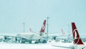 ISTANBUL, TURKEY - JANUARY 07: Airliners are seen at the the snow covered apron of Ataturk International Airport during the heavy snowfall in Istanbul, Turkey on January 07, 2017. Due to the heavy snowfall, preventing landing at Ataturk International Airport, Airliners are diverted to Sabiha Gokcen International Airport. Several flights has been canceled due to bad weather conditions. Izzet Taskiran / Anadolu Agency