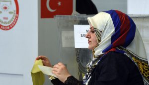 A polling clerk is working at a polling station in Munich, southern Germany, on March 27, 2017.  Turkish expatriates in Germany and five other European countries started casting their ballots Monday in a controversial referendum that could vastly boost President Recep Tayyip Erdogan's powers. / AFP PHOTO / Christof STACHE